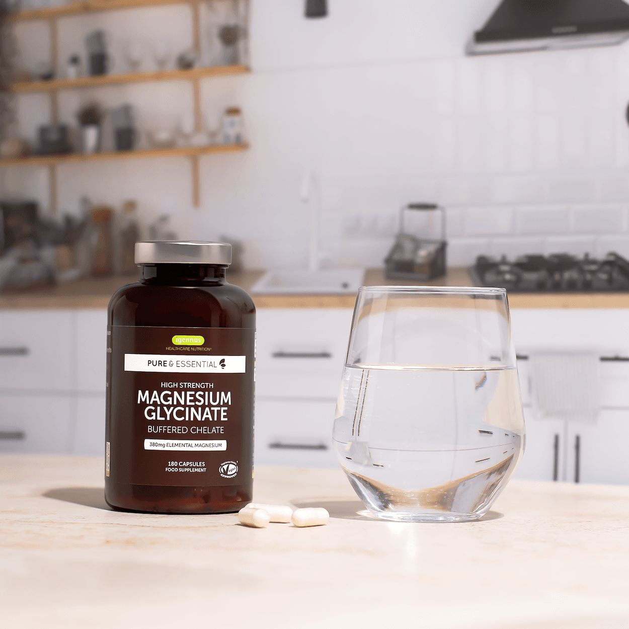 Magnesium supplement bottle with a glass of water in a kitchen