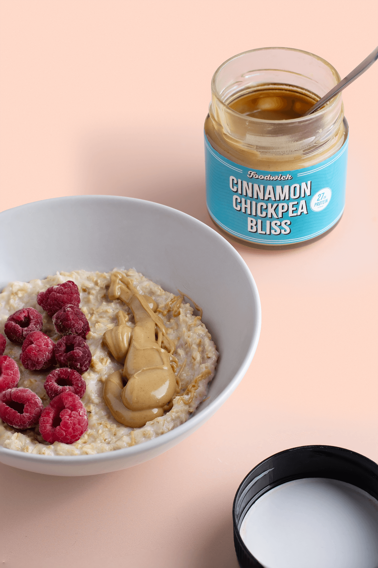 Chickpea spread beside a breakfast bowl with fruit