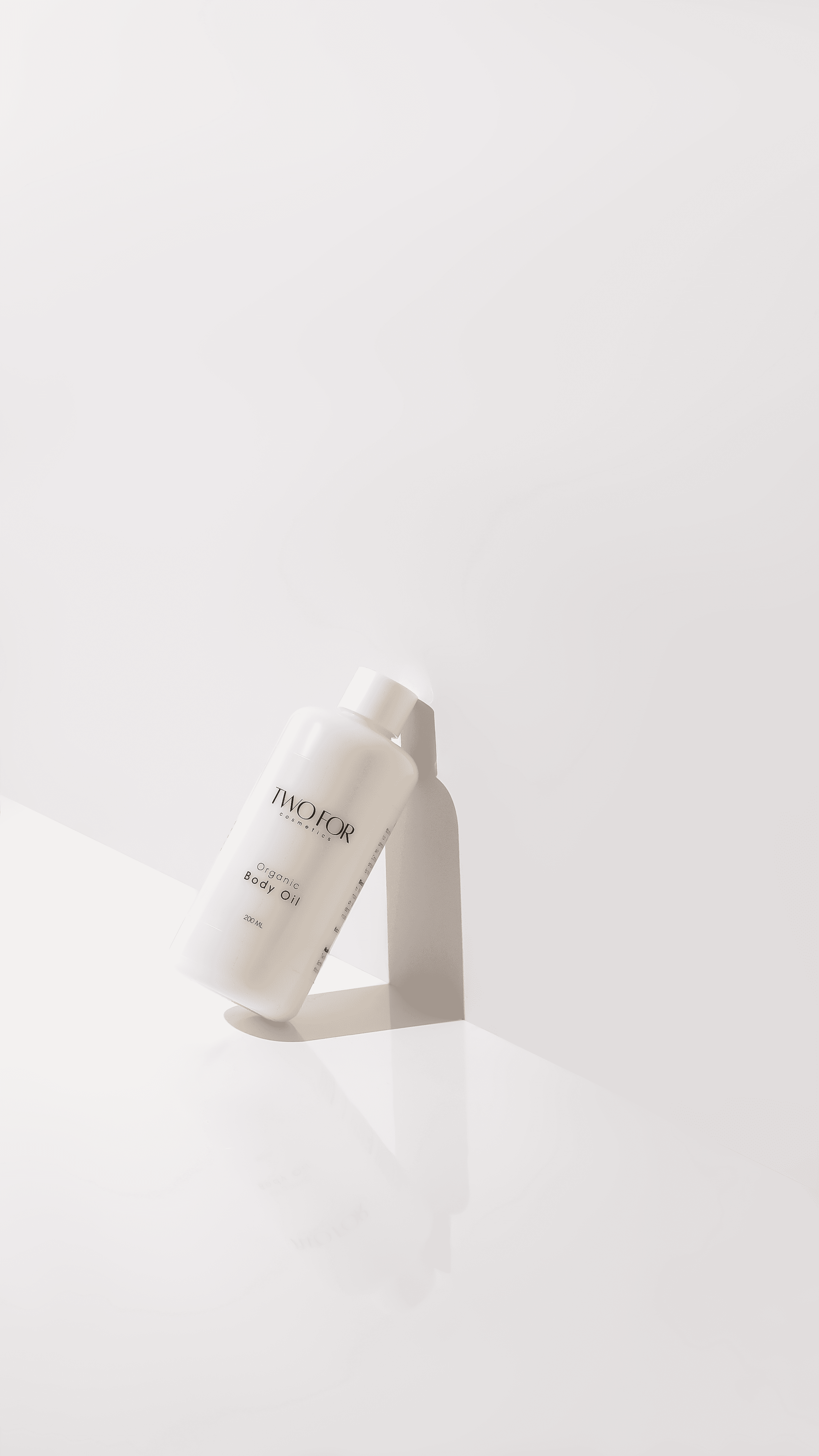 White cosmetic tube casting a soft shadow on a pale background