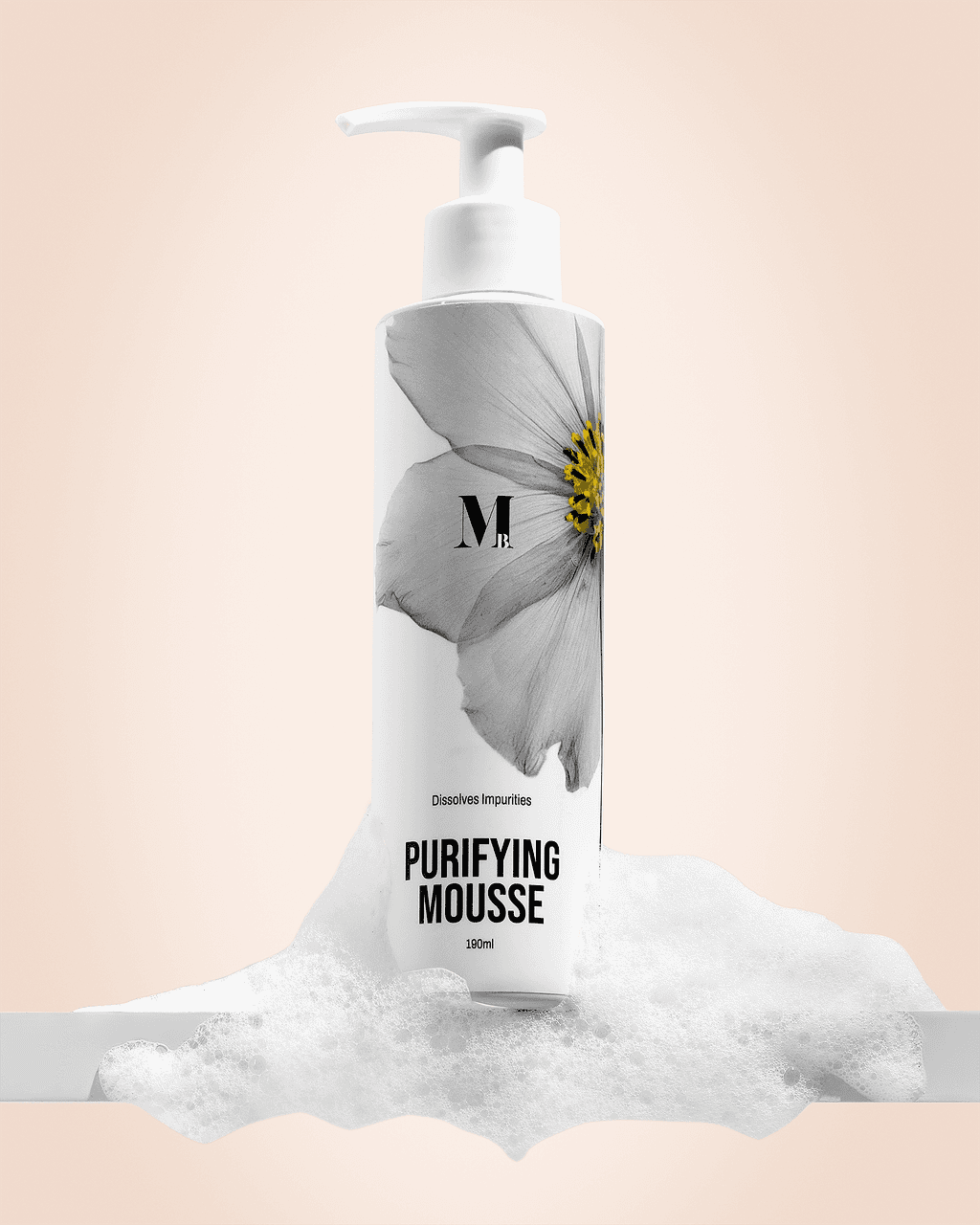 White cleansing mousse bottle styled with soft foam on peach